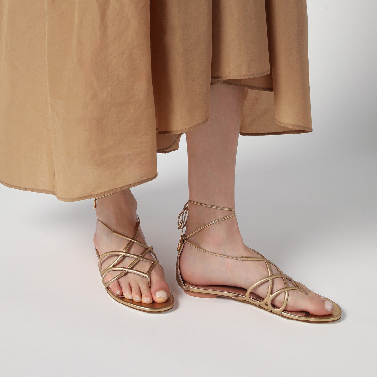 Aquazzura Low gold leather sandal